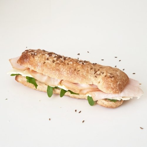Seelen - German Swabian long bread roll specialty with coarse sea salt and caraway seeds - here shown as sandwich - by BREADISTA