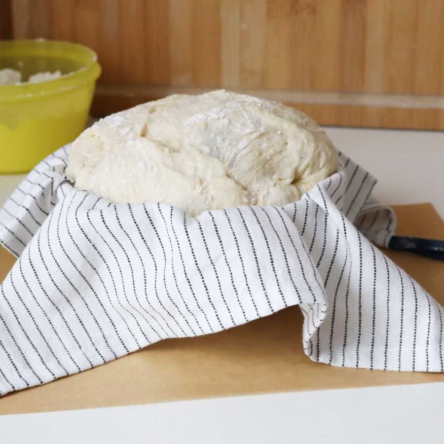 risen dough piece in a towel lined cereal bowl and ready to bake - BREADISTA