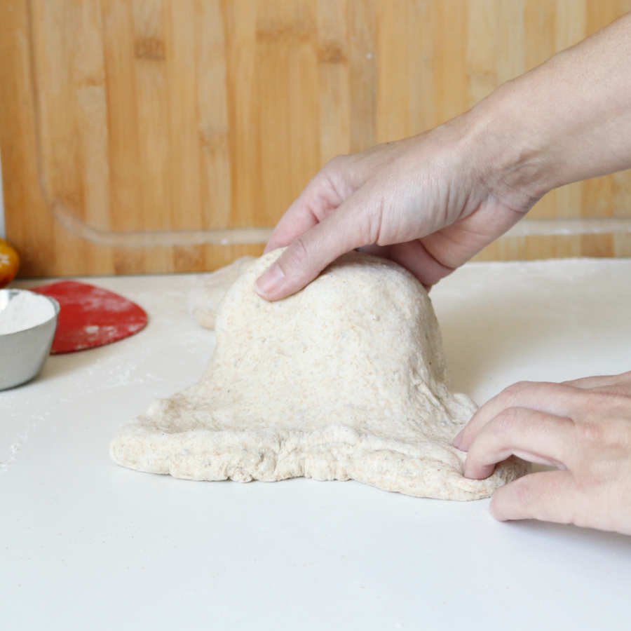 piece of raw dough pulled out by hand - Breadista