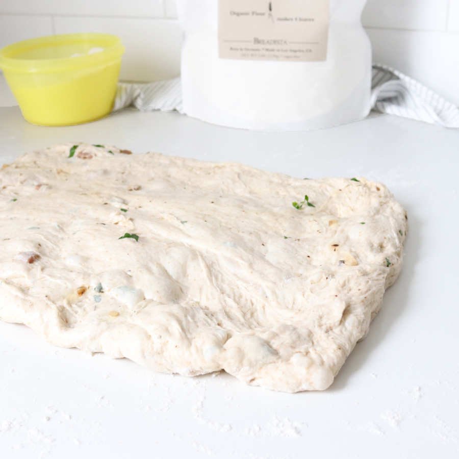 flattened bread dough in a rectangle shape - BREADISTA