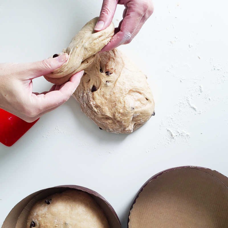 Birdview - dough piece on counter gets folded by two hands by BREADISTA