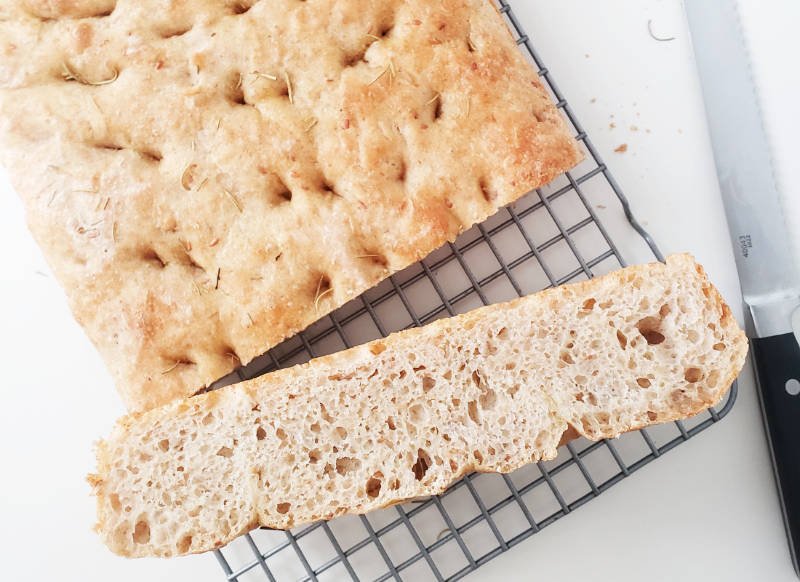 crumb shot rustic Focaccia with flax seeds on rack - birdview - by BREADISTA