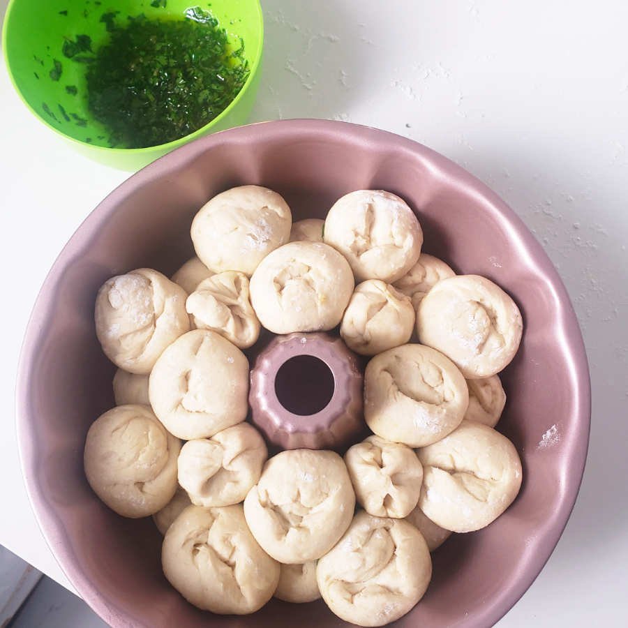 birdview - many dough pieces placed in bundt pan by BREADISTA