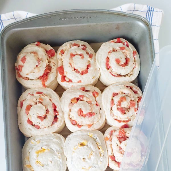homemade pizza rolls - 12 cut rolls in baking pan risen and ready to bake - BREADISTA