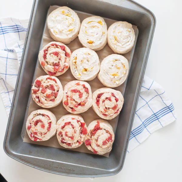 homemade pizza rolls - 12 cut rolls in baking pan ready to rise - BREADISTA