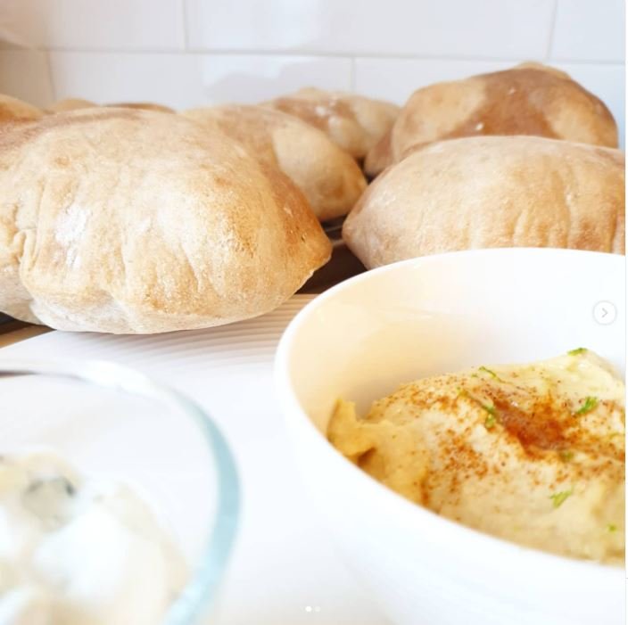 Pita Pockets - Bread - with hummus in front by BREADISTA