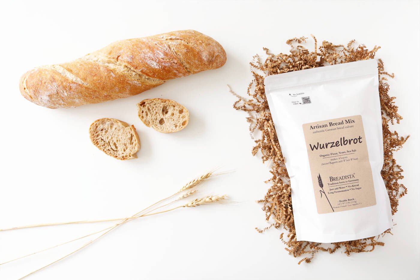 Lifestyle brand image - baked Wurzelbrot baguette with slices and bread mix package by BREADISTA