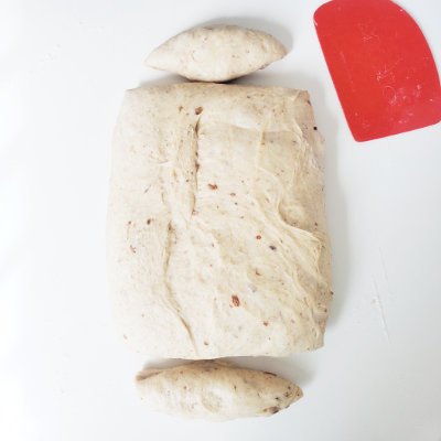 flatten bread dough, parted in 3 pieces = cut the ends to make it a rectangle