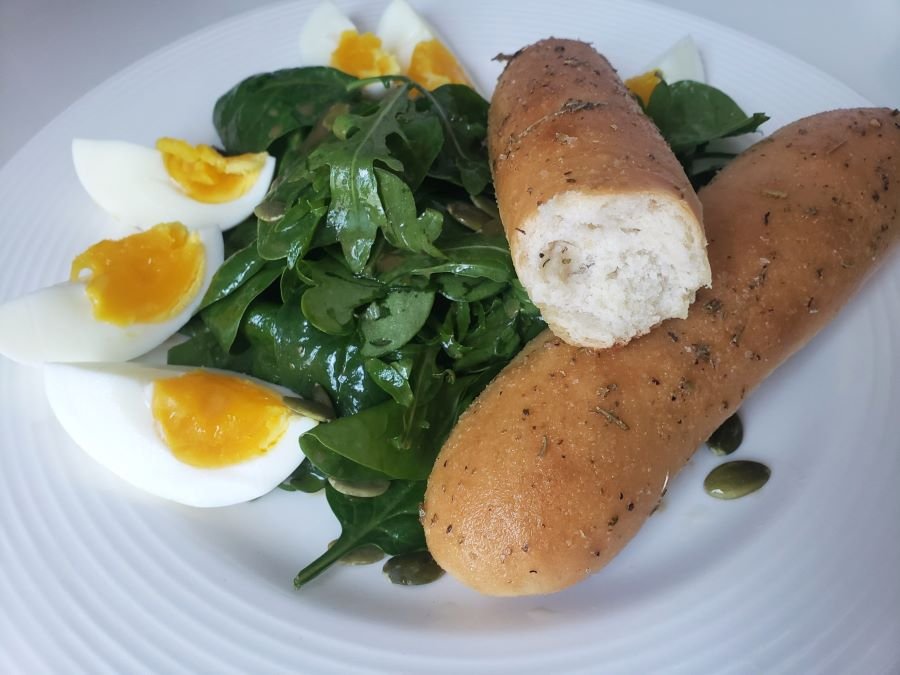 Crumbshot homemade breadsticks by BREADISTA - serving suggestion on green salad with hard boiled eggs