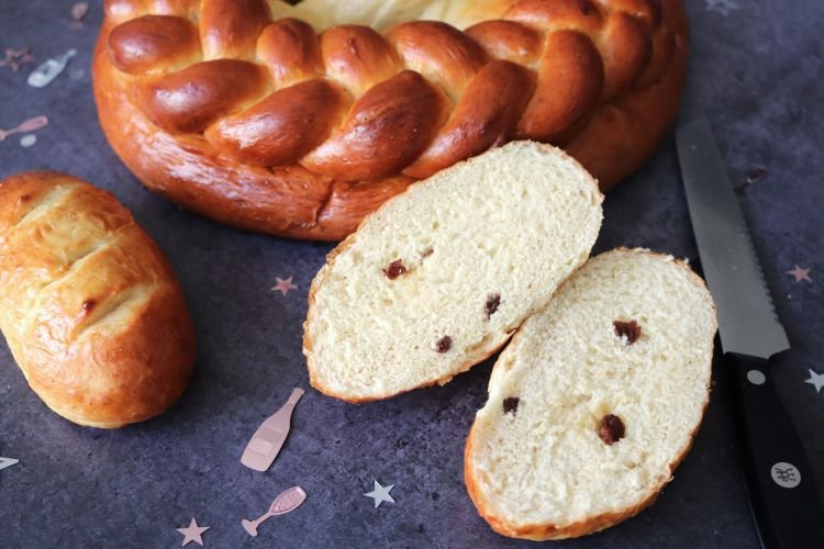 German Neujahrsbrezel with a braided belly and two Neujahrswecken, one cut open with raisins. by BREADISTA, made with Einback bread mix - New Year's Pretzel
