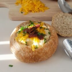 Soup served in bread bowl topped with cheese and bacon bites - by BREADISTA and Chew on This - 2026