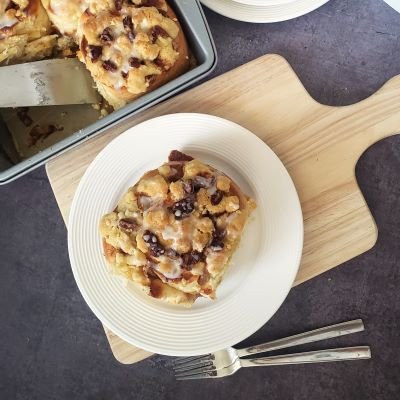 Giant Cinnamon Roll with Streusel topping on white plate - baked - birdview by BREADISTA